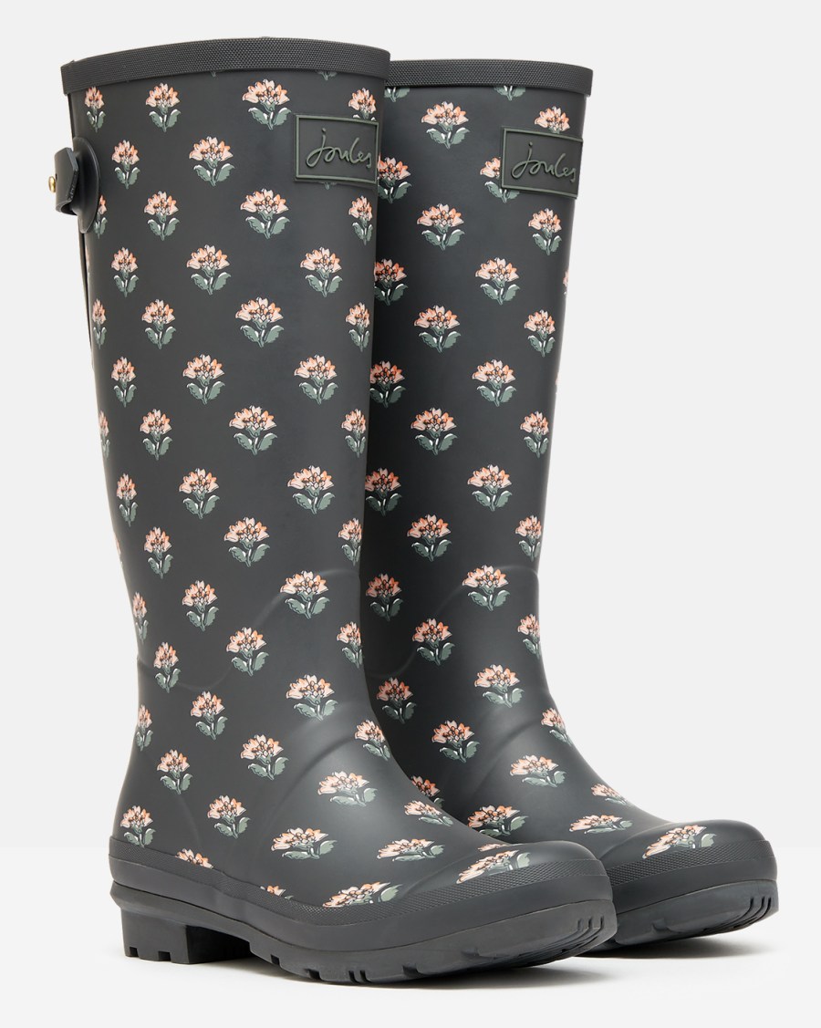 A pair of Joules Printed Wellies with Back Gusset. They are grey with a pink and green flower pattern 