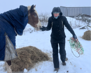 Caring for her horse in the snow is easier when staying warm in the Catago Trainer Winter Jump Suit, says Your Horse's tester Stephanie