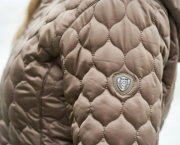 Side image of the Covalliero Long Quilted Coat with logo on top of the sleeve