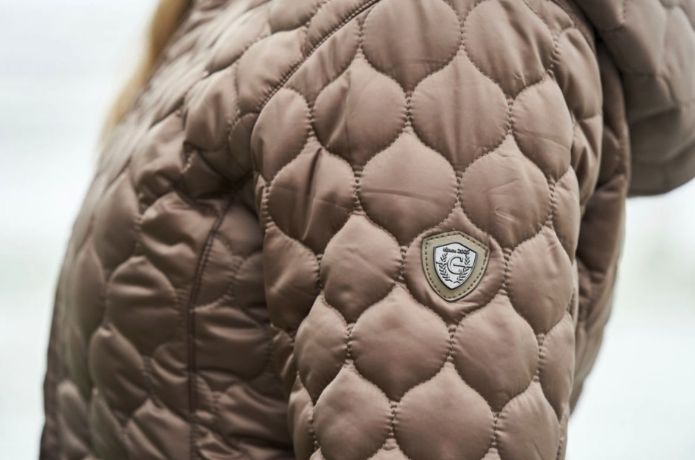 Side image of the Covalliero Long Quilted Coat with logo on top of the sleeve