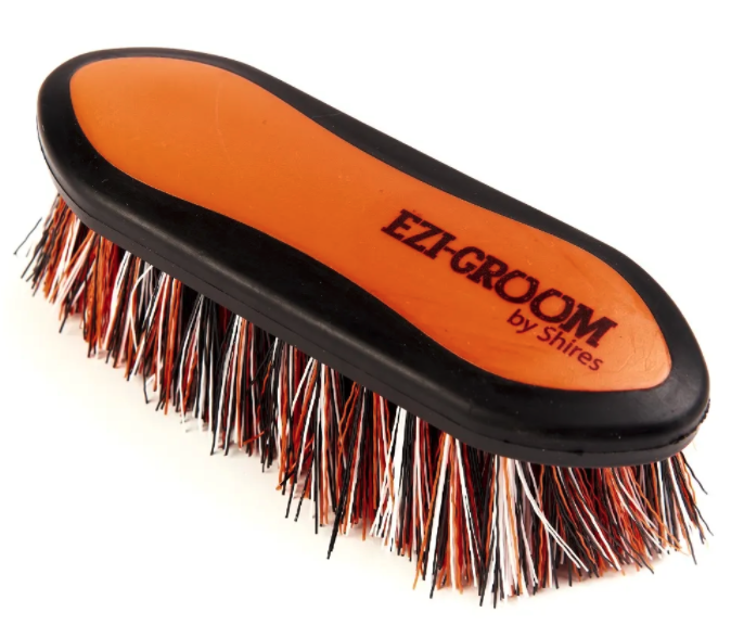 Types of horse brushes: the Ezi-Groom Grip Dandy Brush from Shires Equestrian
