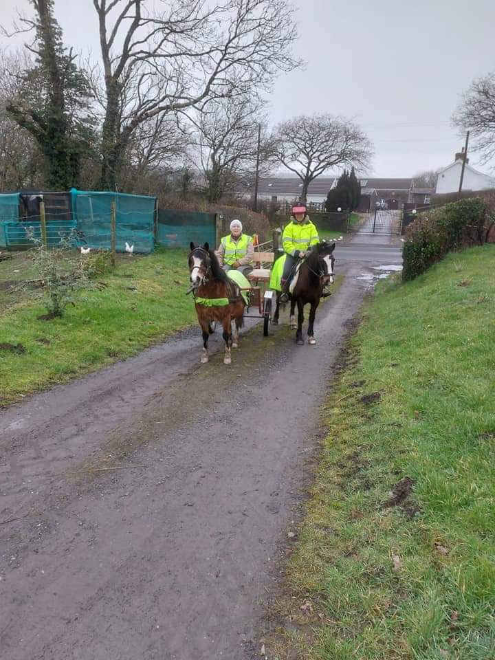 Pictured are Katie and Billy wearing high vis before going for a hack