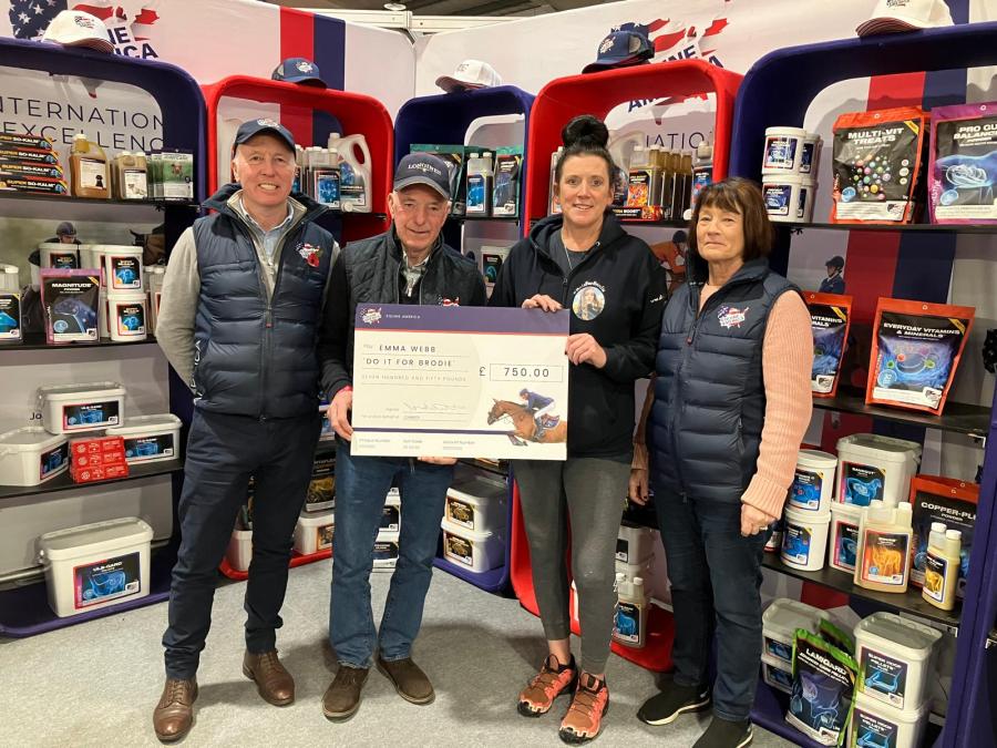 Emma Webb receives cheque from John Whitaker at Your Horse Live