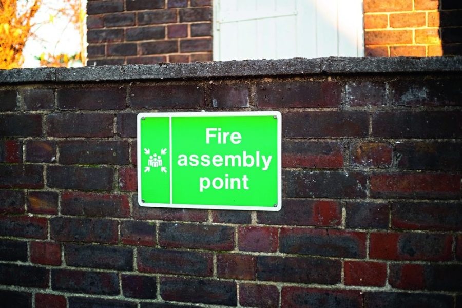 Fire assembly point sign on the wall
